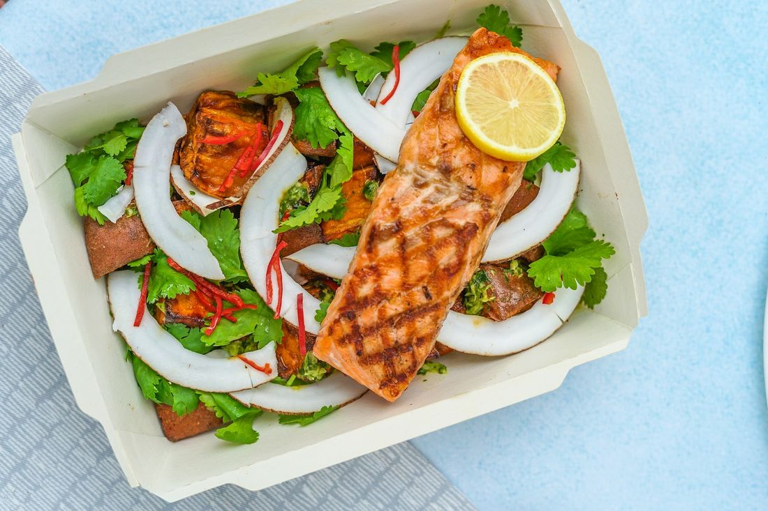 Grilled salmon salad packed in a lunch box
